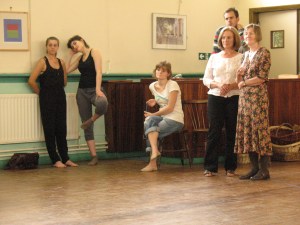 Dancers and Chorus members listen to Gremin sing