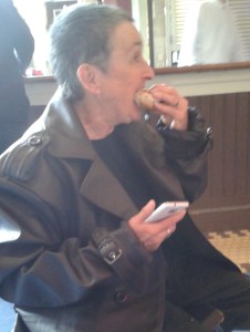 Alix in Hench-coat, takes a break from demanding money